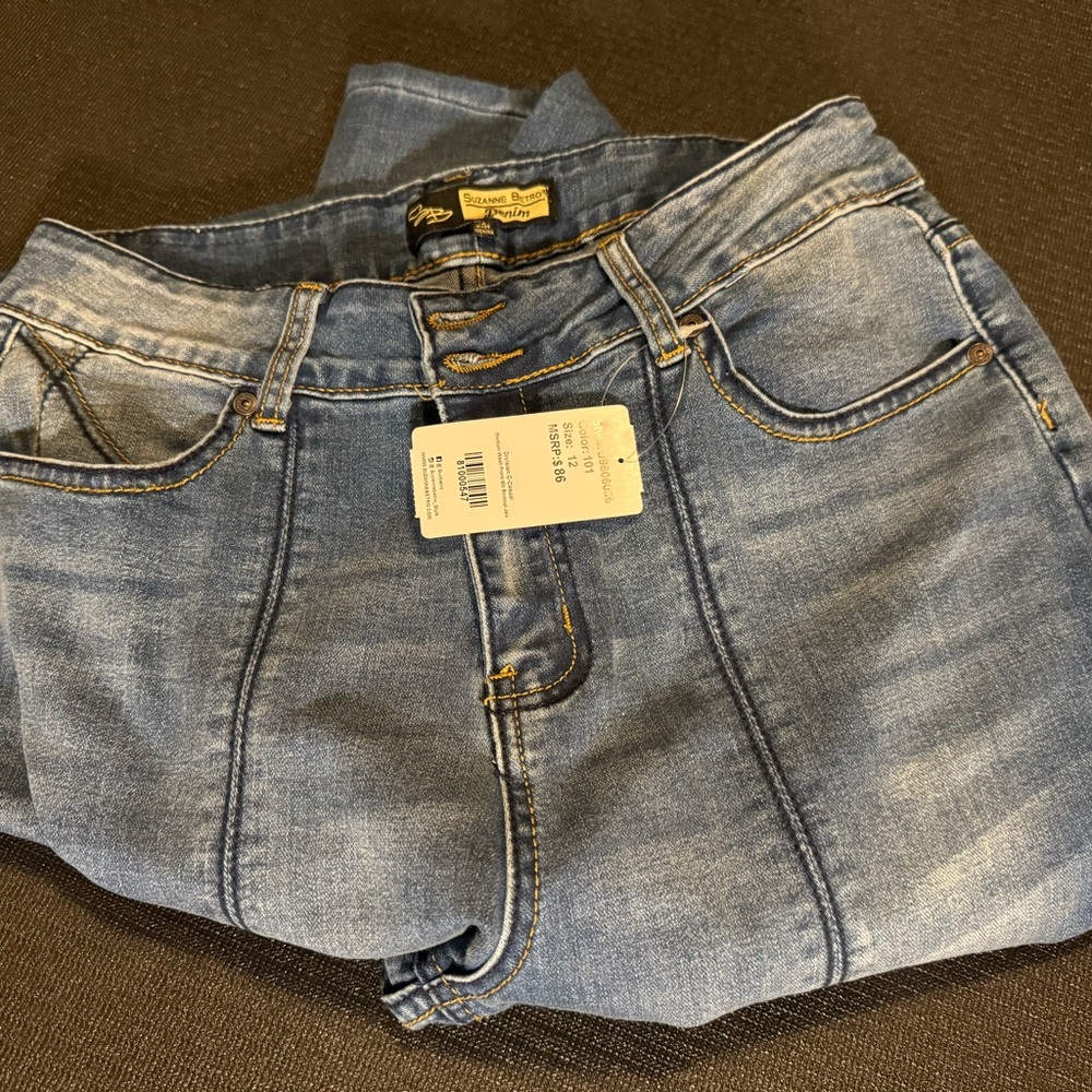 Women’s size 12 Suzanne Betro split front flare, raw hem jeans. BNWT